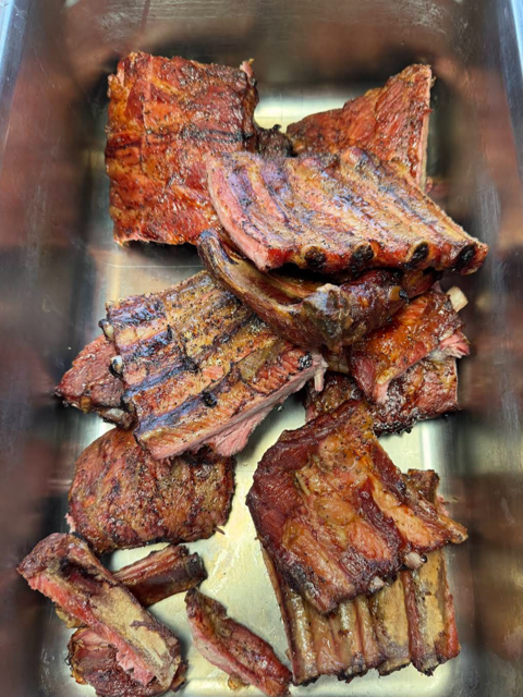 Tray of smoked pork ribs fresh off the smoker