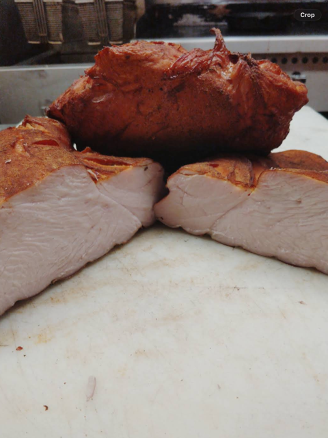 House-smoked turkey breast sliced on the cutting board at the Smoke Shack